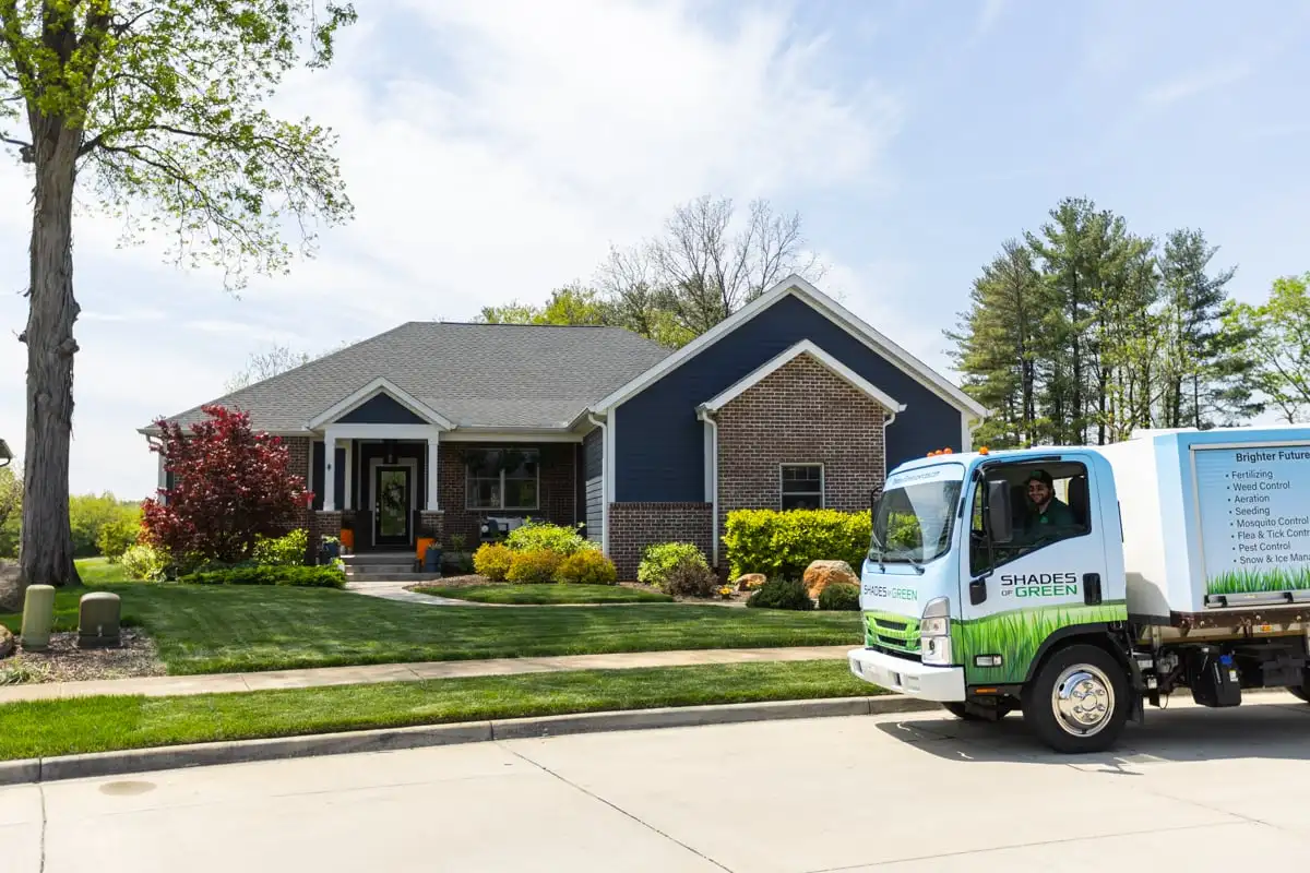 Shades of Green service truck visiting a residential property