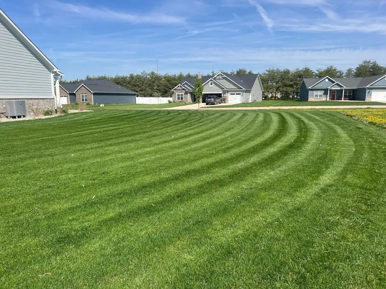 Curved mowing stripes across a large lawn in Attica, Indiana