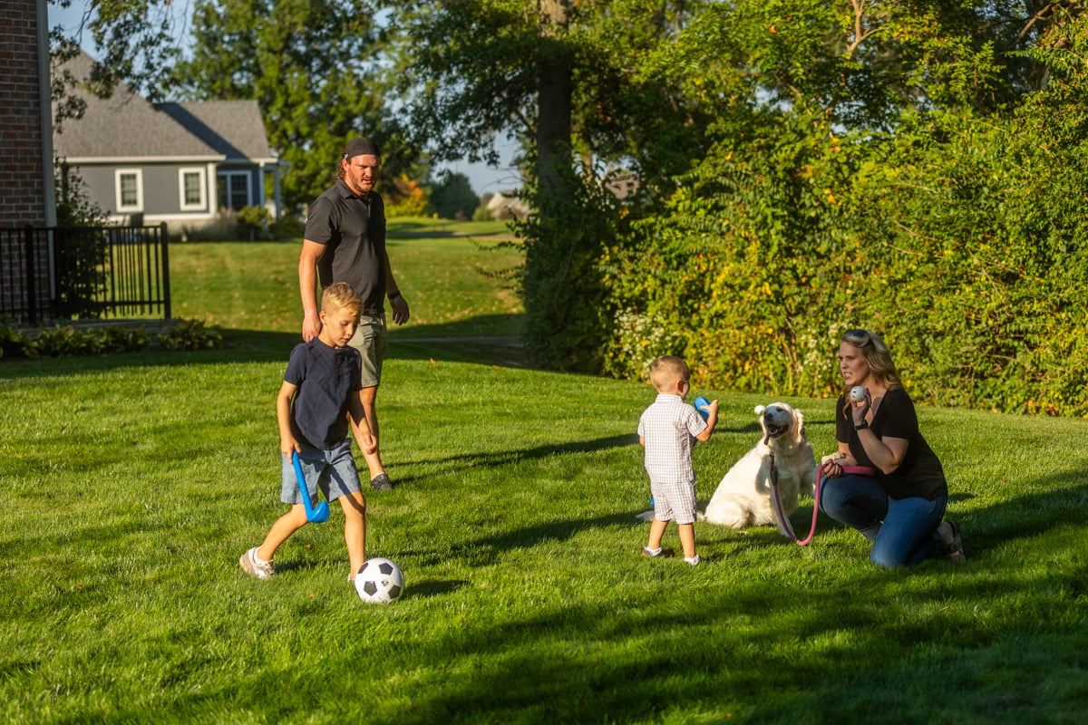 family enjoying a weed-free lawn