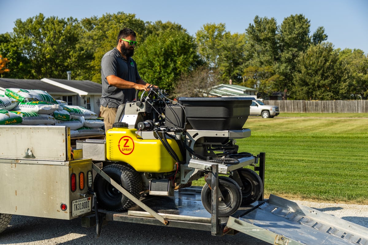 lawn care equipment being unloaded