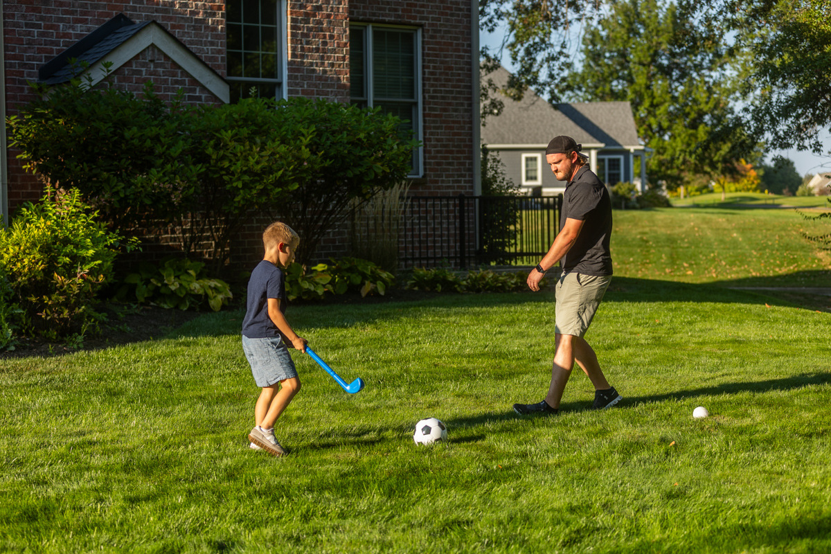 client family kids playing lawn grass 6