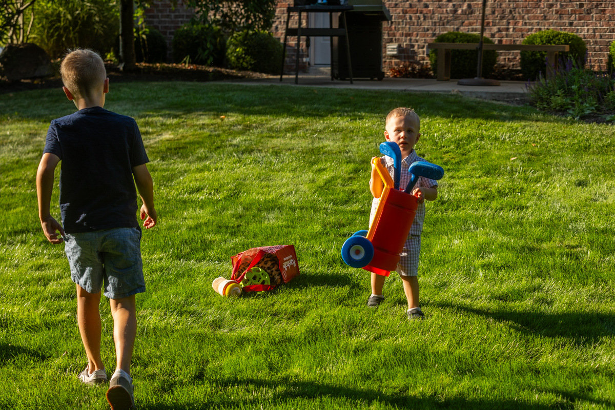 client family kids playing lawn grass